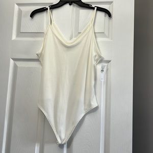Cream colored ribbed body suit